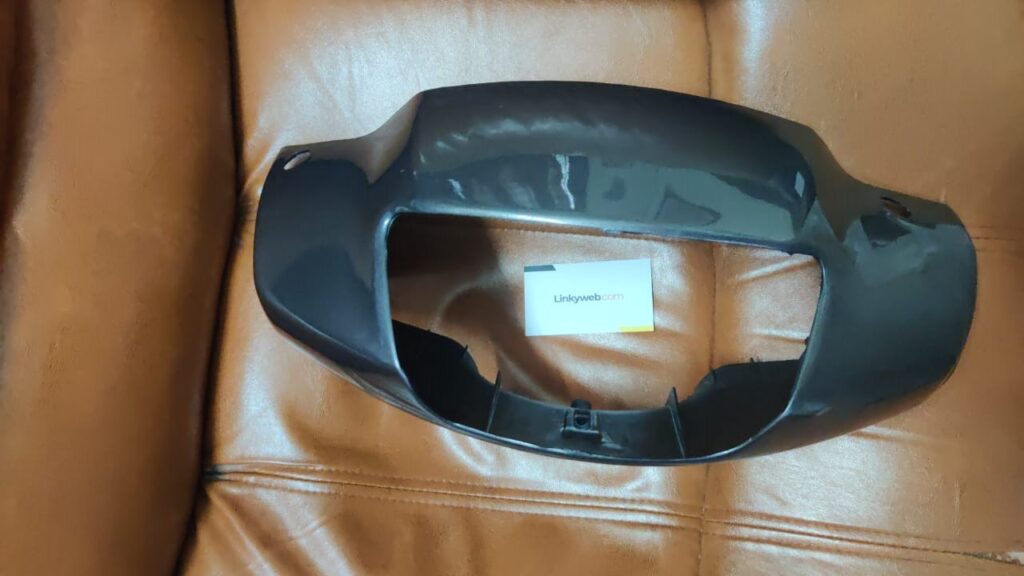 Hero Eterno Headlight Visor Mask Fairing Grey mounted on a scooter
