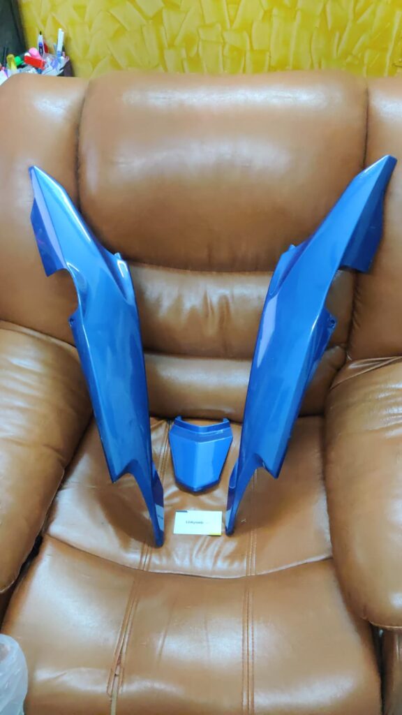 honda livo tail panel blue displayed against a neutral background showing its smooth finish