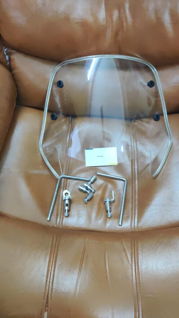 tvs jupiter classic visor glass with fittings installed on scooter