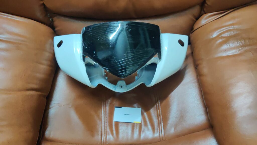Black activa 125 headlight visor mask fairing viewed from the front