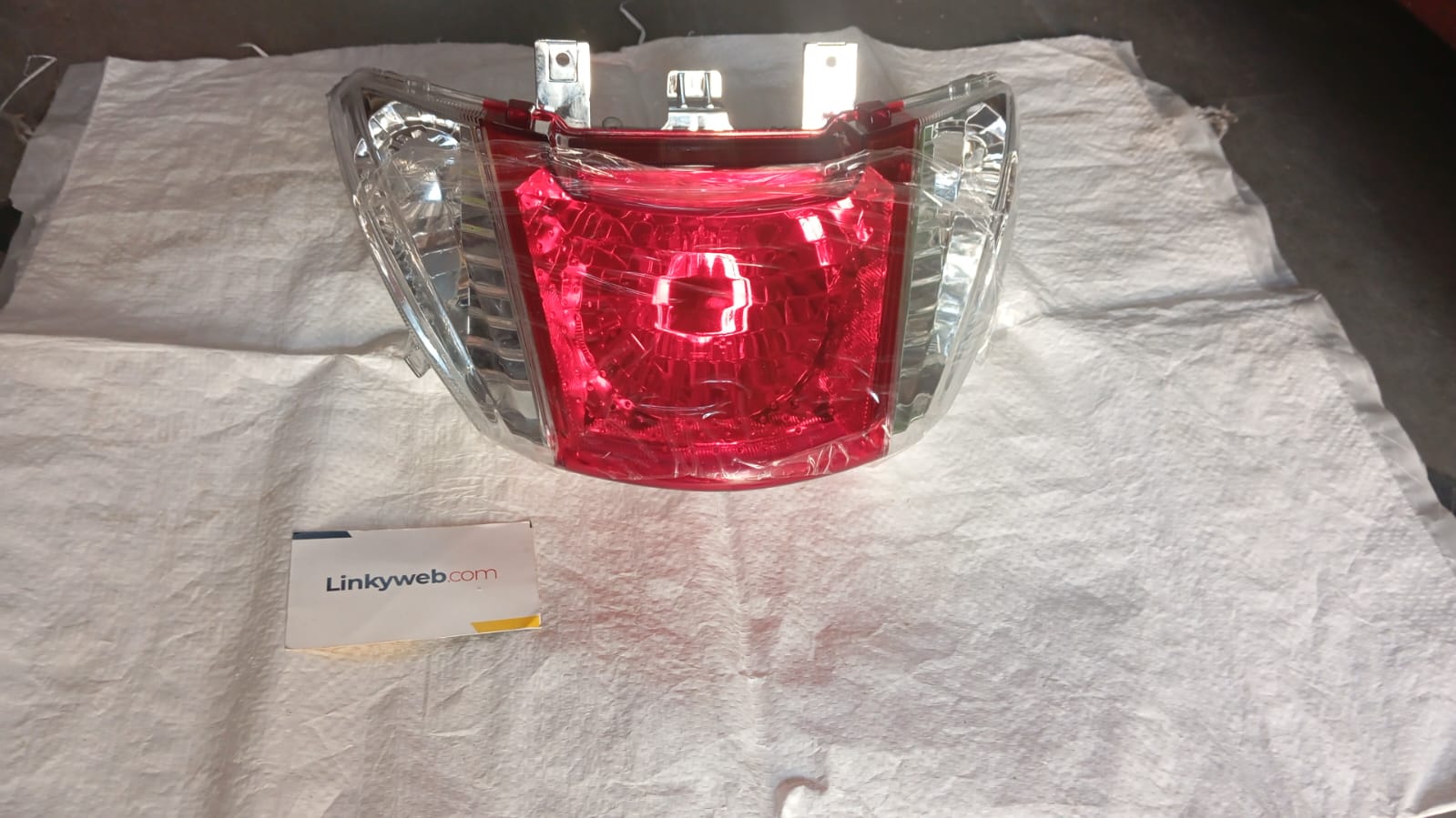 Honda Activa i tail light assembly showing red lens and housing