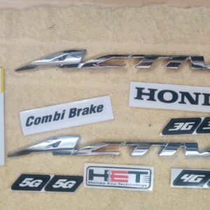 Close-up of a sleek metallic activa monogram badge designed for Honda scooters.
