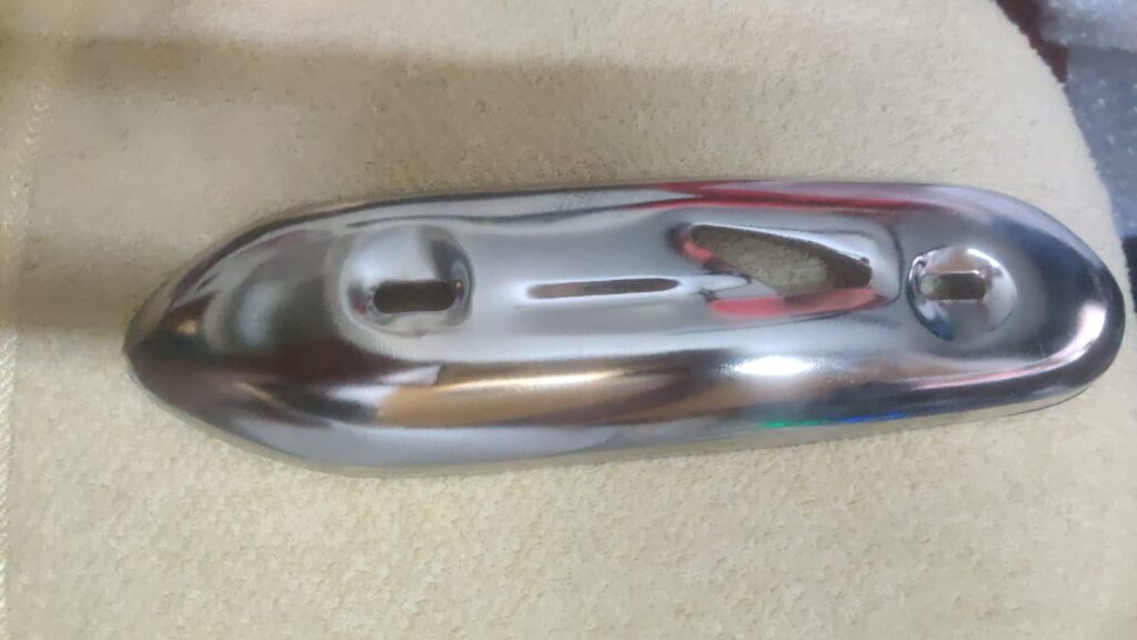 Activa silencer plate chrome plated exhaust cover mounted on a scooter