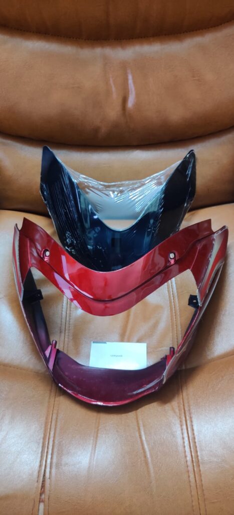 Bajaj XCD 135 visor front view showing durable fiber headlight mask fairing