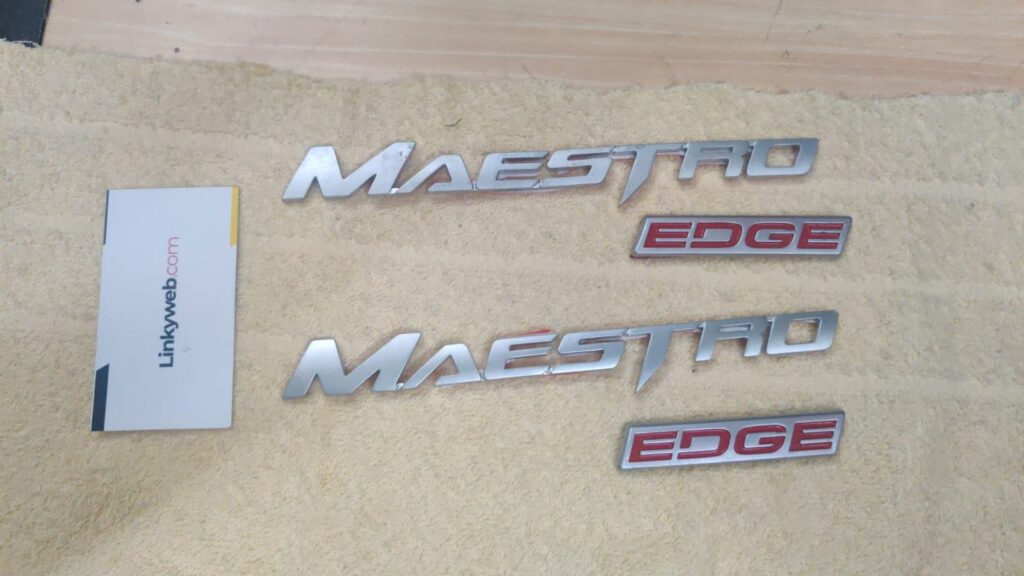 Hero maestro edge logo badge on display for scooter upgrade