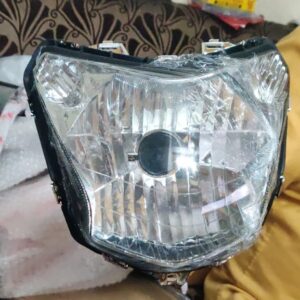 Hero Passion X Pro Headlight Assembly showing precision contours and lens design