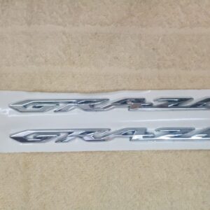 Honda grazia logos shown with a sleek metallic finish for scooter styling