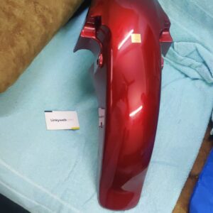 Honda shine red mudguard made of durable fiber material displayed on a neutral background