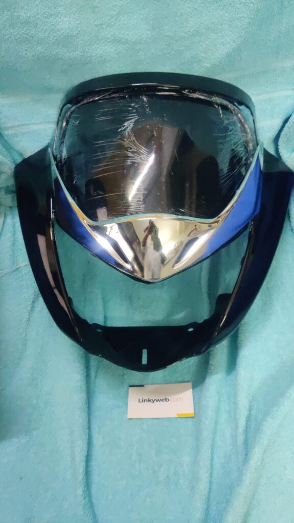 Honda Unicorn BS6 Visor black fiber headlight cover mounted on motorcycle