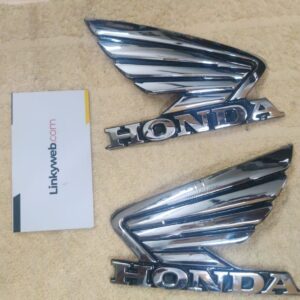 Close-up shot of durable honda unicorn tank logos on a fuel tank
