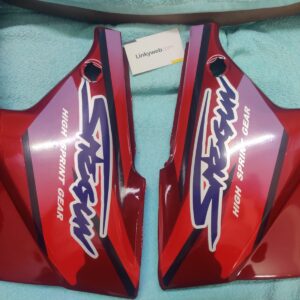 Suzuki Shogun red side panel showing vibrant finish and durable build