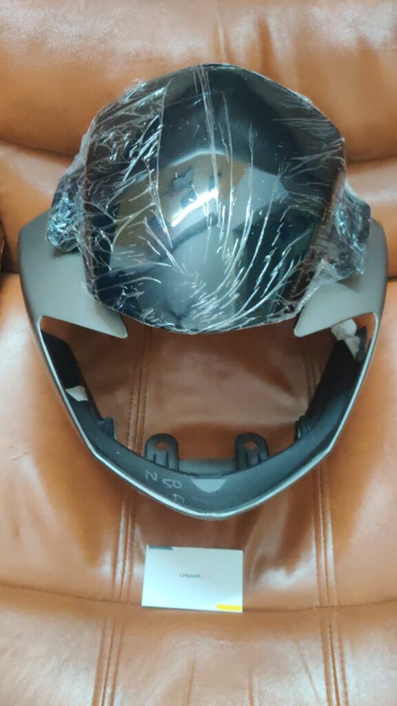 tvs apache rtr headlight visor in grey color displayed for motorcycle styling