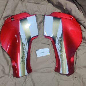 A brand new tvs victor glx side panel red set with matching stickers for motorcycles.