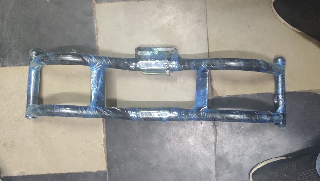 Heavy duty metal yamaha fz leg guard mounted on a motorcycle